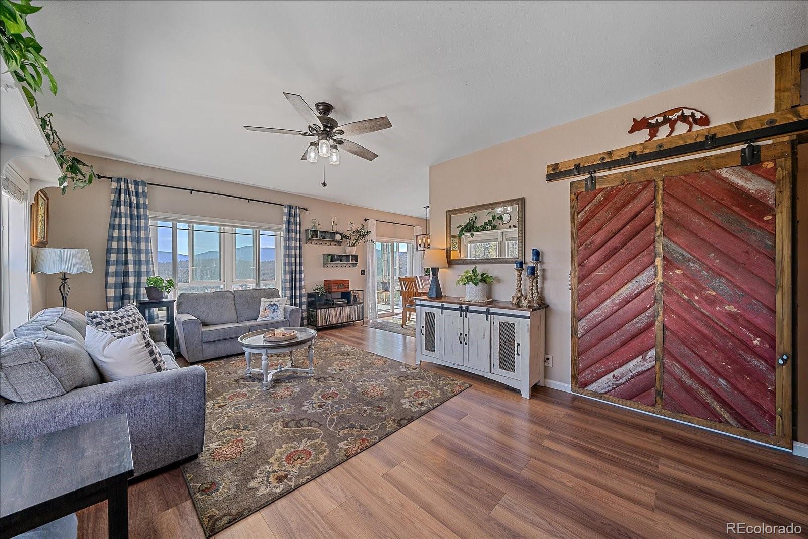147 Overlook Drive Bailey, CO 80421 - Photo 5 of 43 a living room with furniture and wooden floor