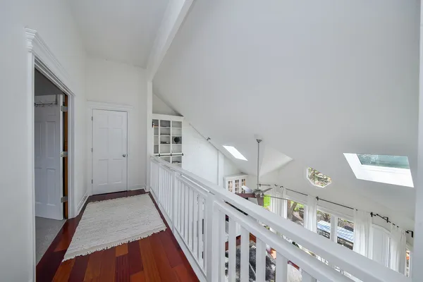 a view of a hallway with windows