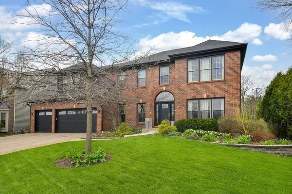 a brick house with a large windows