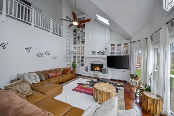 a living room with furniture fireplace and a flat screen tv