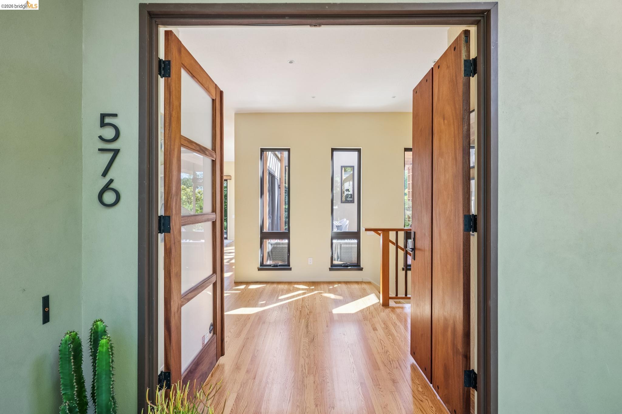 576 Vistamont Avenue Berkeley, CA 94708 - Photo 5 of 33 Entryway featuring double wood-finish doors with frosted glass panels