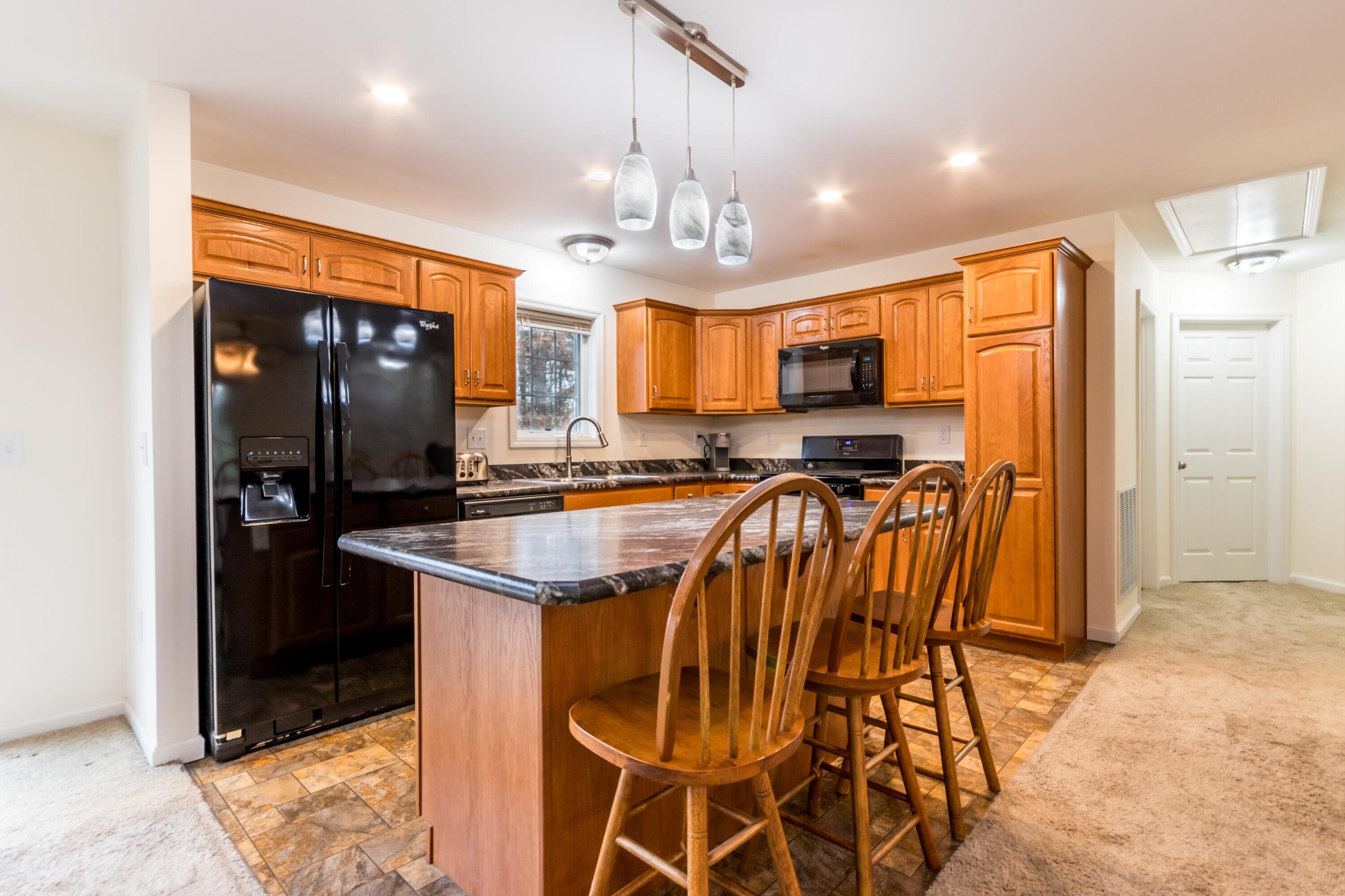 98 Leland Road Brewster, MA 02631 - Photo 12 of 38 Kitchen with island and breakfast bar