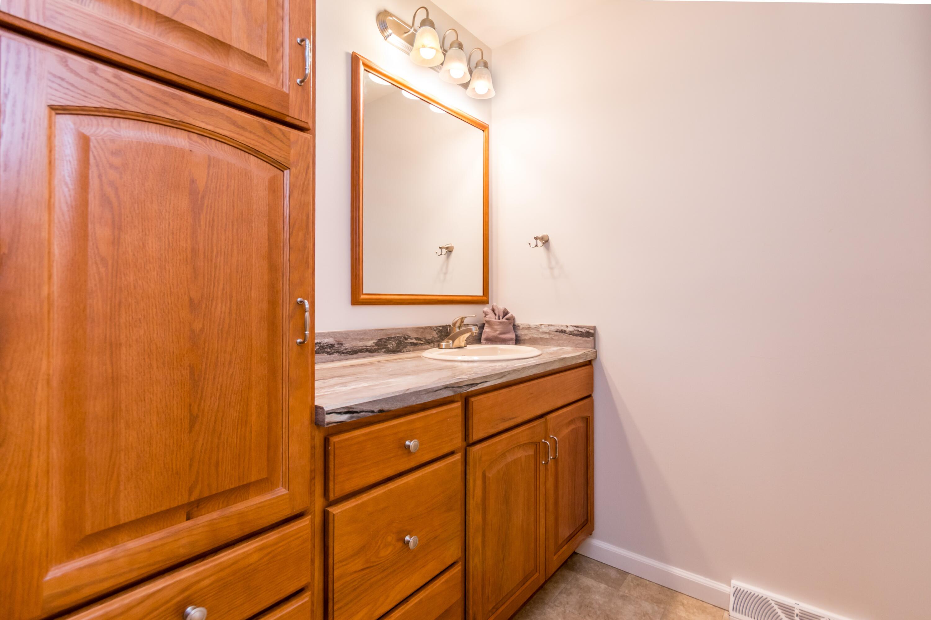 98 Leland Road Brewster, MA 02631 - Photo 17 of 38 Primary bath with storage