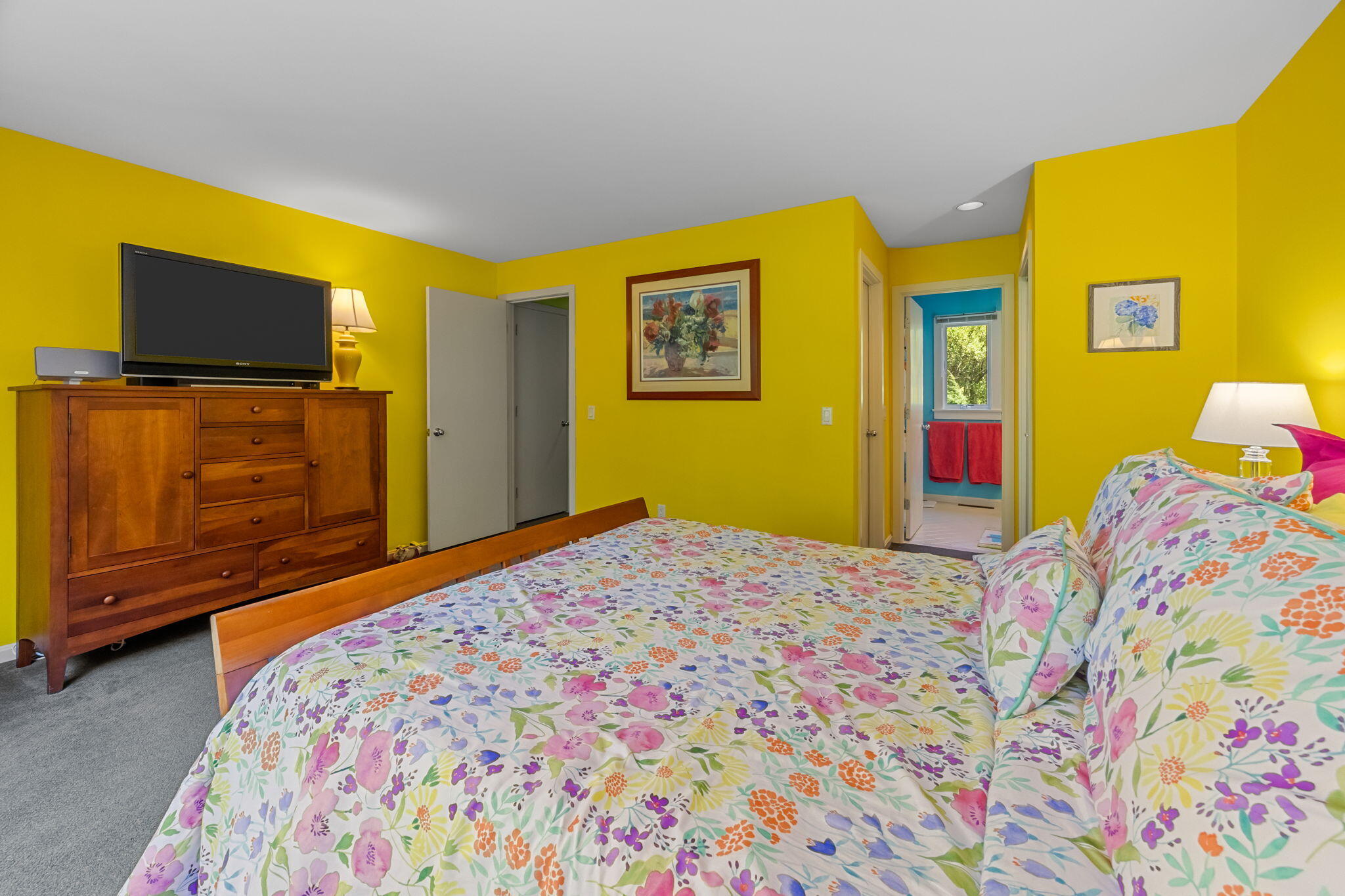 11 Juniper Circle, Unit 11 Brewster, MA 02631 - Photo 17 of 52 a bedroom with a bed and flat screen tv