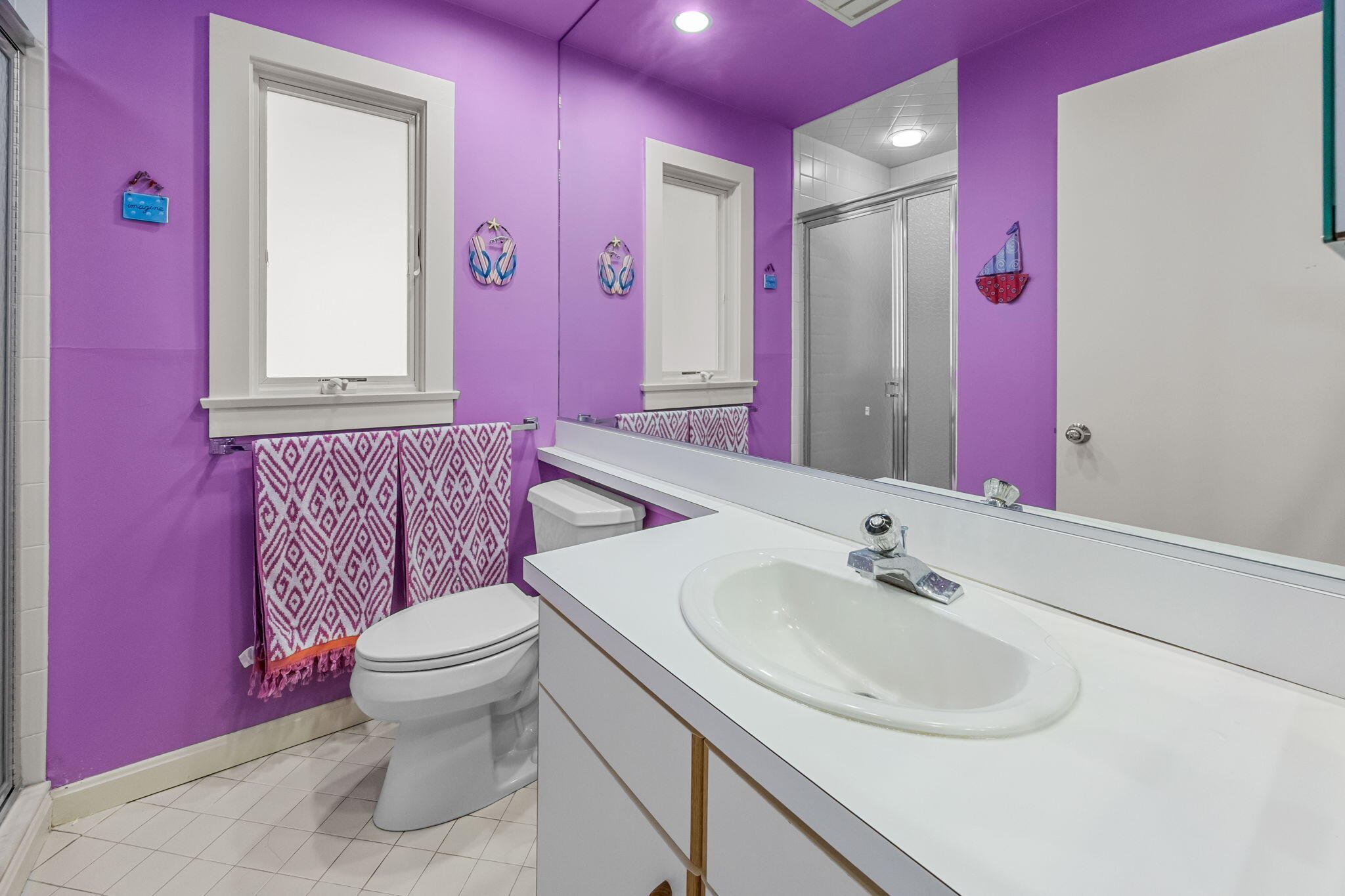 11 Juniper Circle, Unit 11 Brewster, MA 02631 - Photo 21 of 52 a bathroom with a sink vanity mirror and toilet