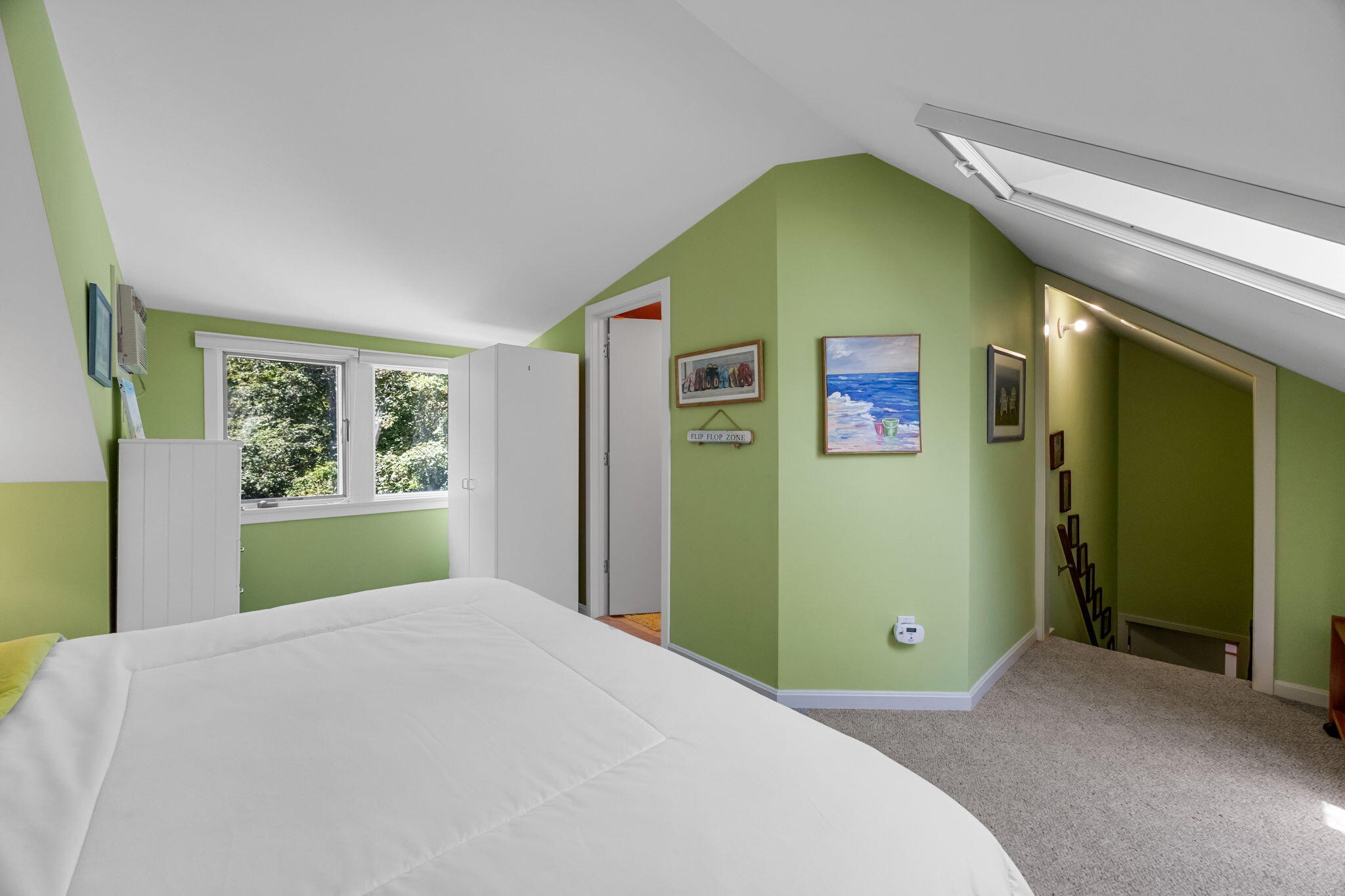 11 Juniper Circle, Unit 11 Brewster, MA 02631 - Photo 23 of 52 a bedroom with a bed and a window