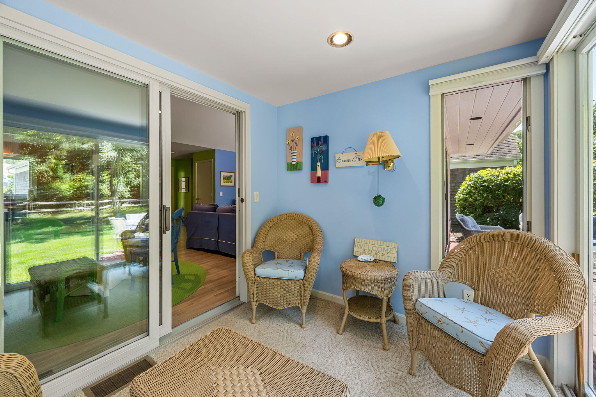 11 Juniper Circle, Unit 11 Brewster, MA 02631 - Photo 26 of 52 a living room with furniture and a floor to ceiling window