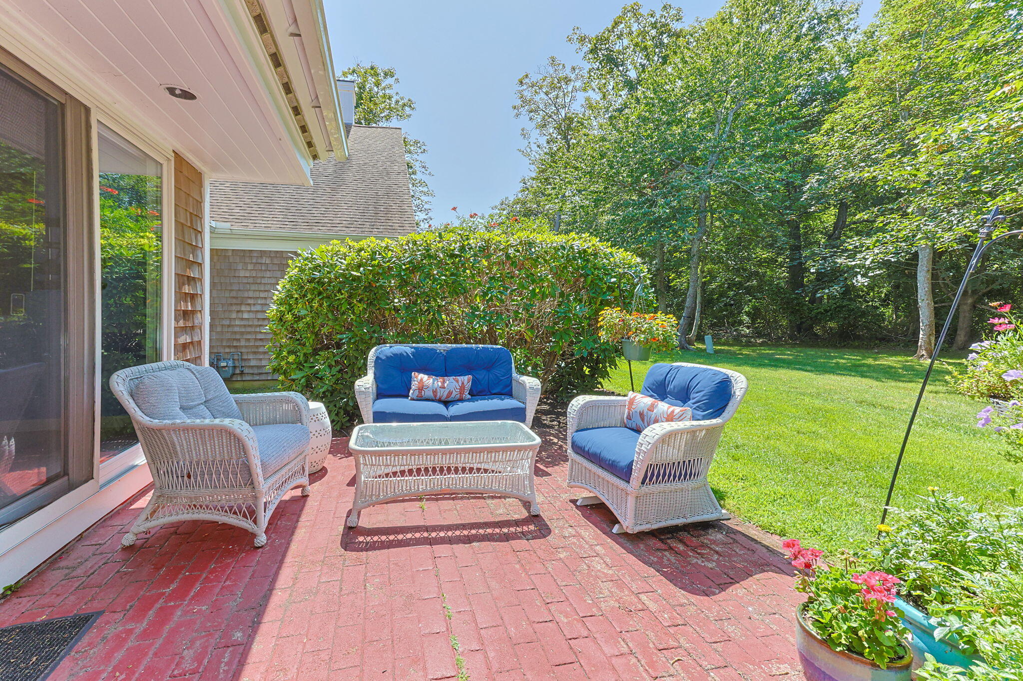 11 Juniper Circle, Unit 11 Brewster, MA 02631 - Photo 27 of 52 a house view with a seating space and garden