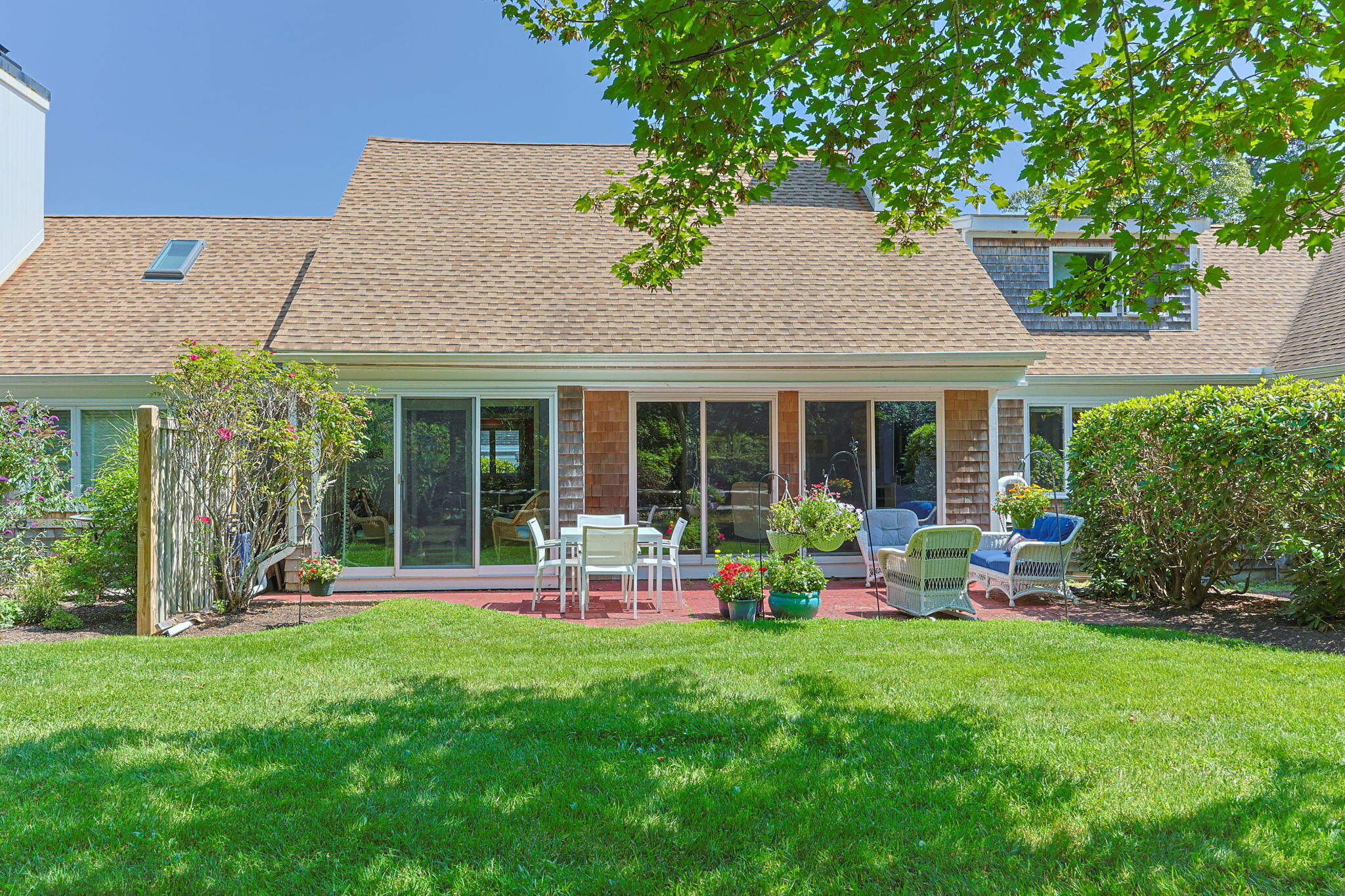 11 Juniper Circle, Unit 11 Brewster, MA 02631 - Photo 30 of 52 a front view of house with yard and outdoor seating