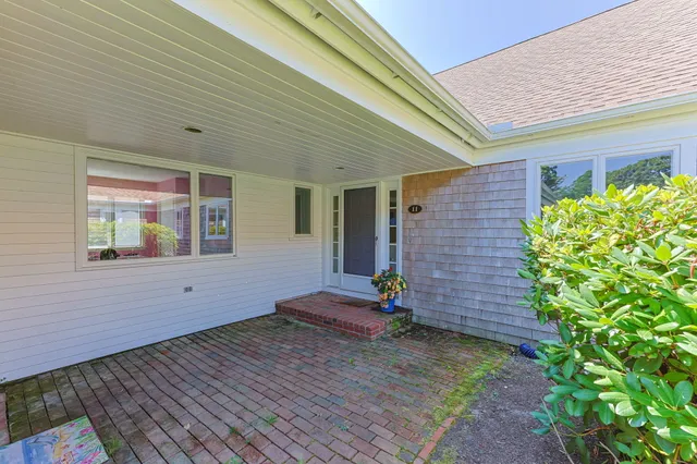a front view of house with an outdoor space
