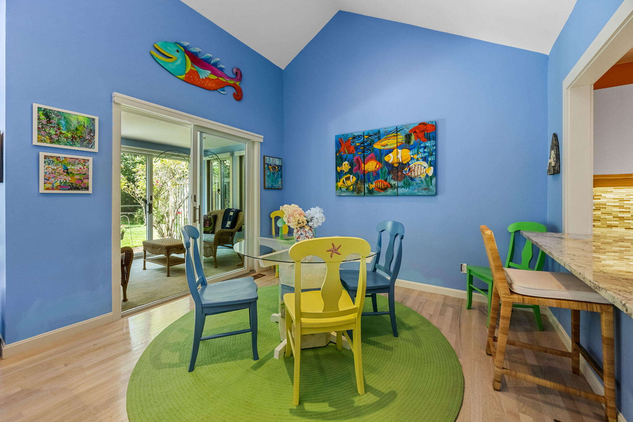 11 Juniper Circle, Unit 11 Brewster, MA 02631 - Photo 9 of 52 a view of a dining room with furniture one side kitchen view and wooden floor