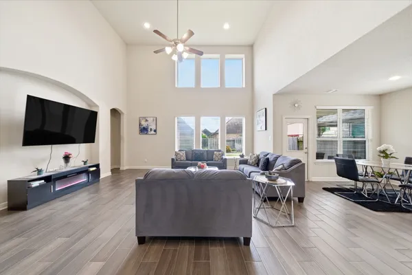 a living room with furniture and a flat screen tv