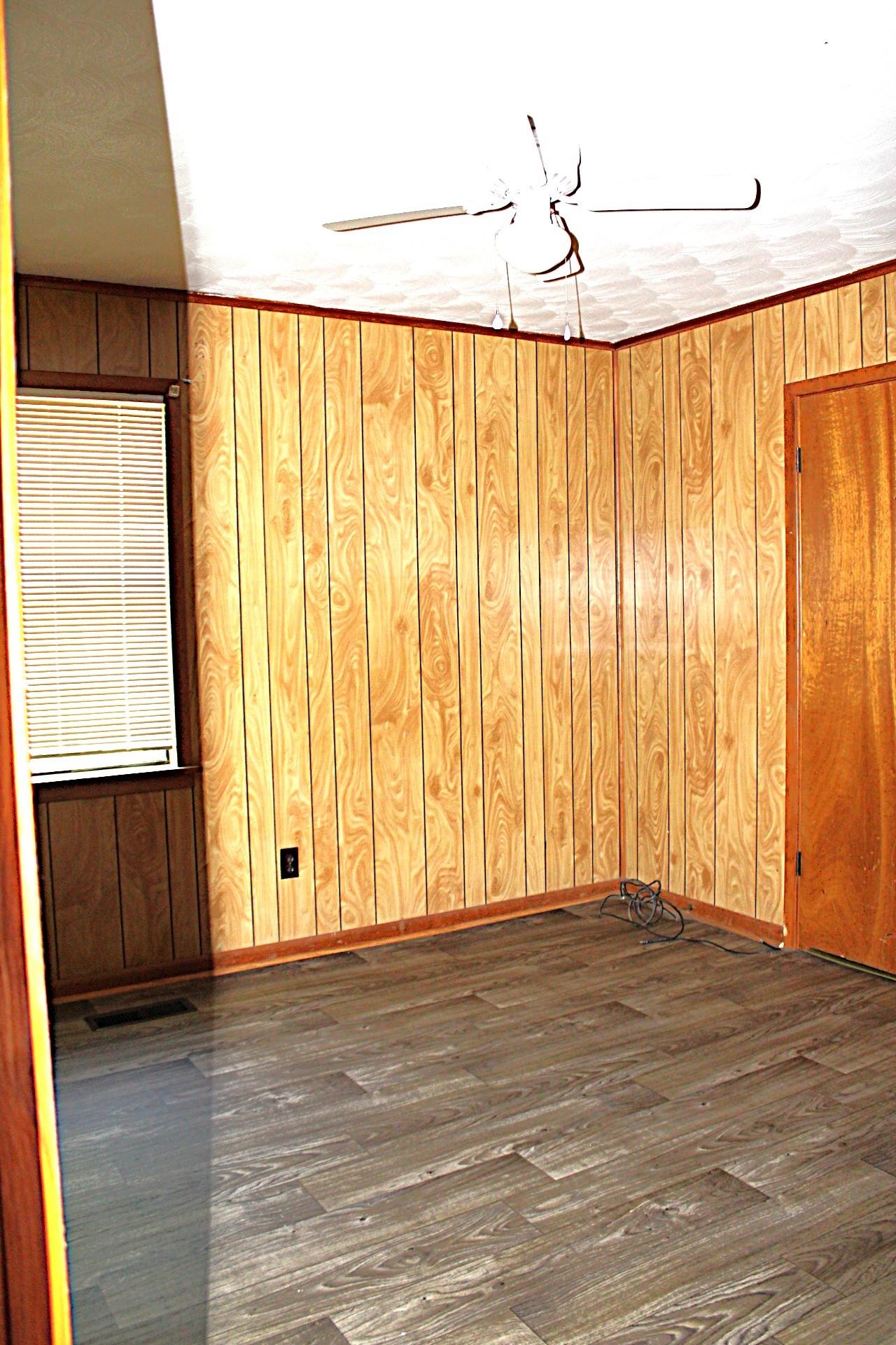 584 Chisholm Lake Road Ripley, TN 38063 - Photo 13 of 28 a view of wooden floor and windows in a room
