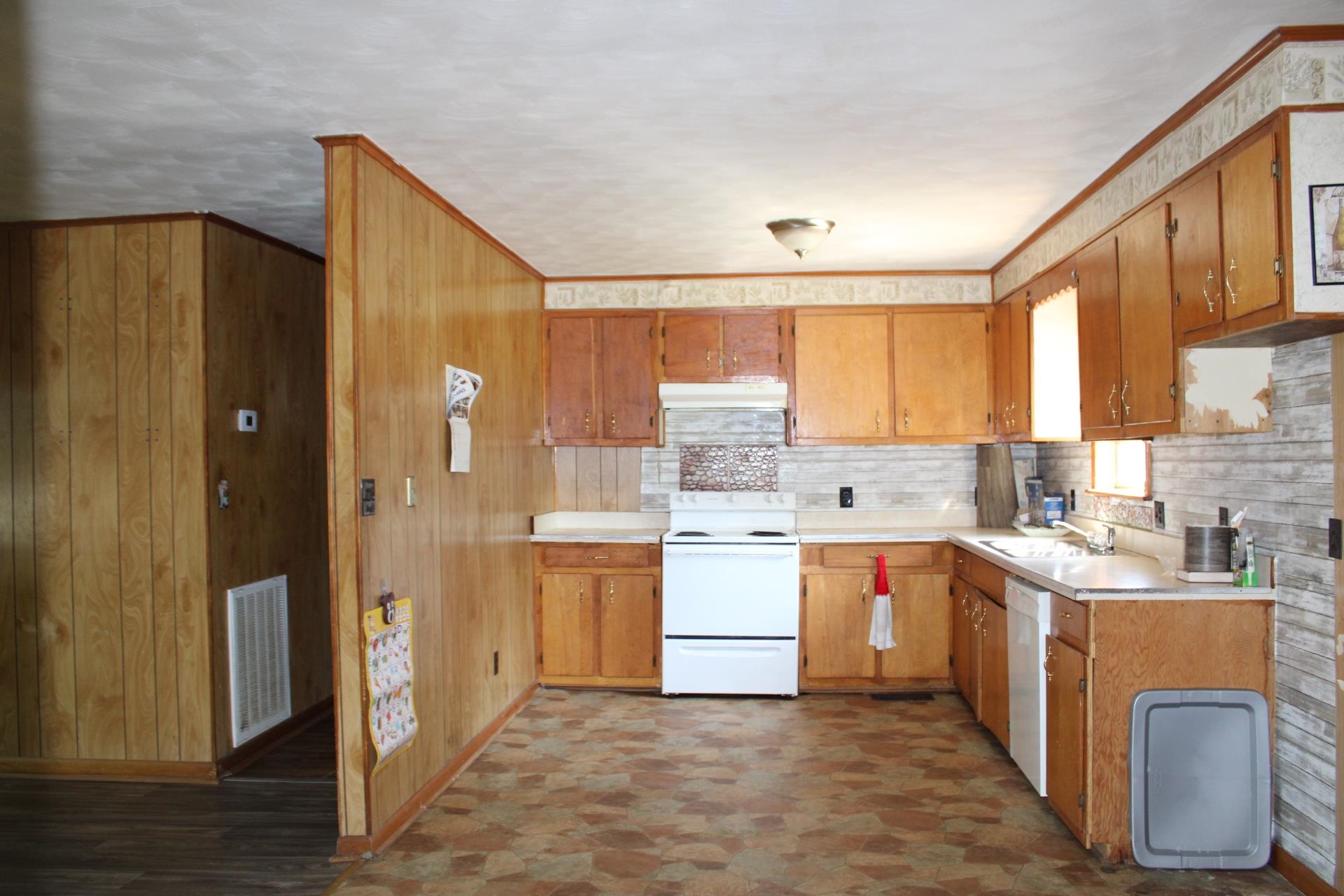 584 Chisholm Lake Road Ripley, TN 38063 - Photo 2 of 28 a kitchen with a sink stove and cabinets