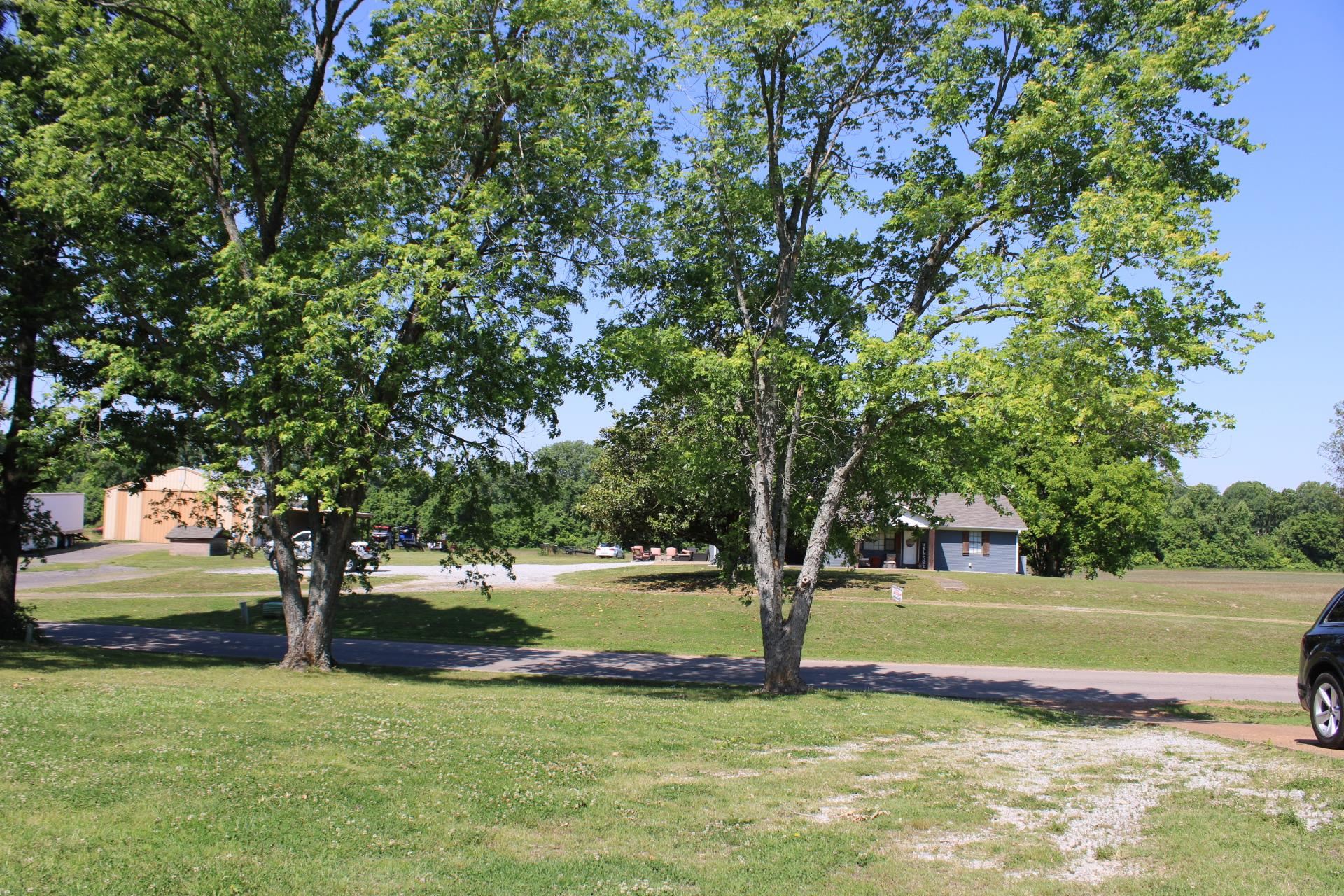 584 Chisholm Lake Road Ripley, TN 38063 - Photo 26 of 28 a view of a house with a yard