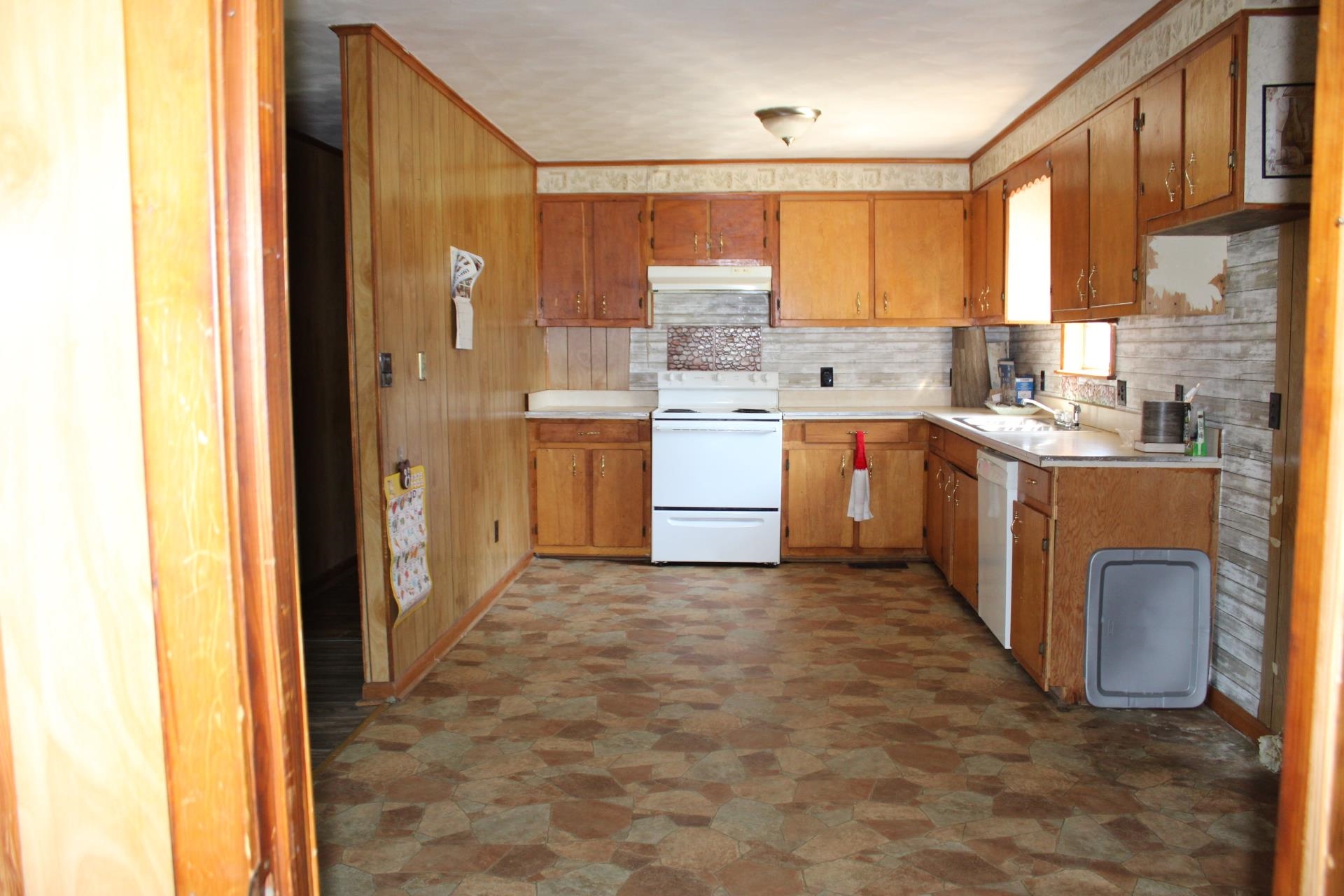 584 Chisholm Lake Road Ripley, TN 38063 - Photo 4 of 28 a kitchen with a sink stove and cabinets