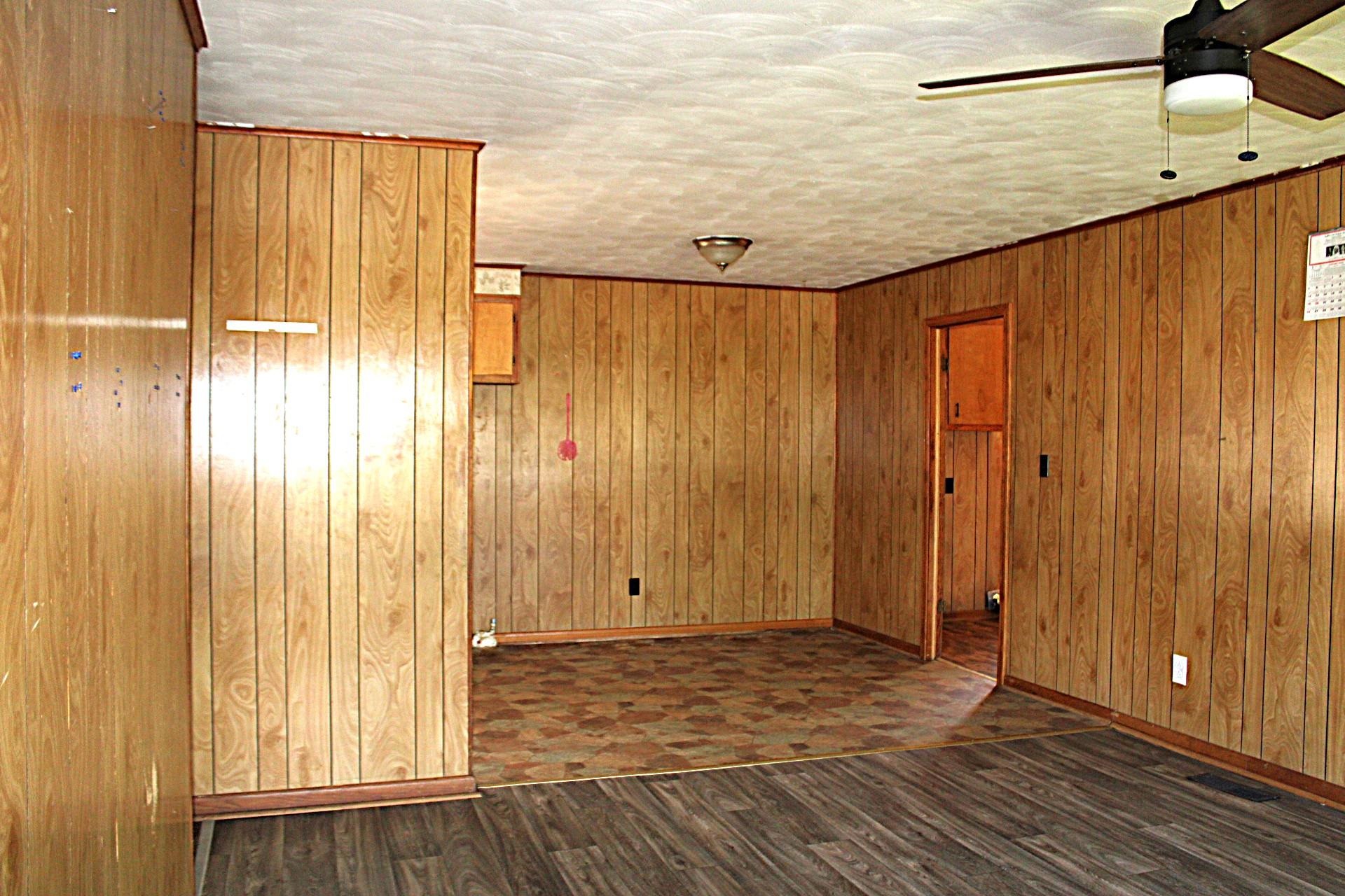 584 Chisholm Lake Road Ripley, TN 38063 - Photo 8 of 28 a view of a room with wooden floor and a window