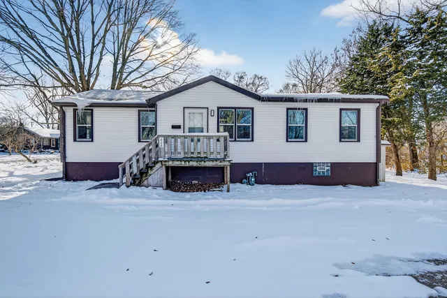 a view of house with a yard