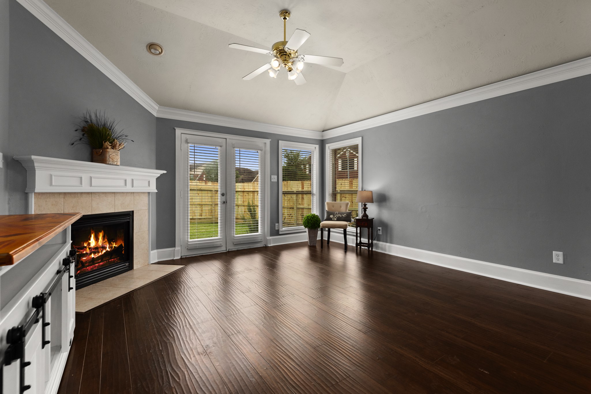 21710 Colter Stone Drive Spring, TX 77388 - Photo 14 of 35 Spacious living room with gas log fireplace leads to back yard.