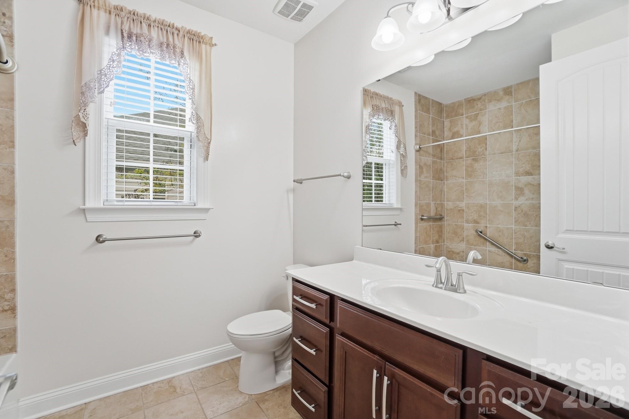 220 Morgan's Branch Road Belmont, NC 28012 - Photo 32 of 42 a bathroom with a sink a toilet and a window