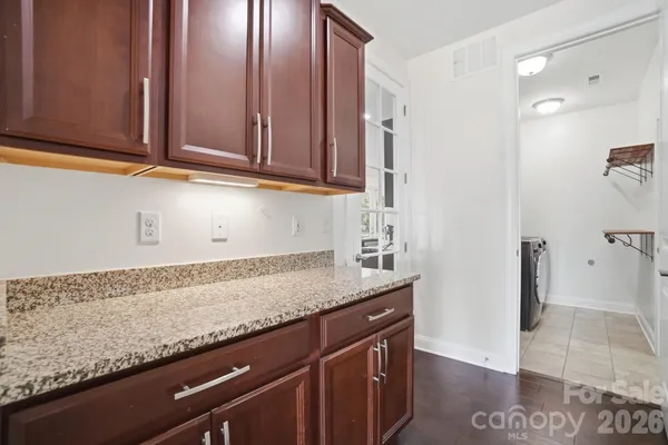 a kitchen with a refrigerator and cabinets