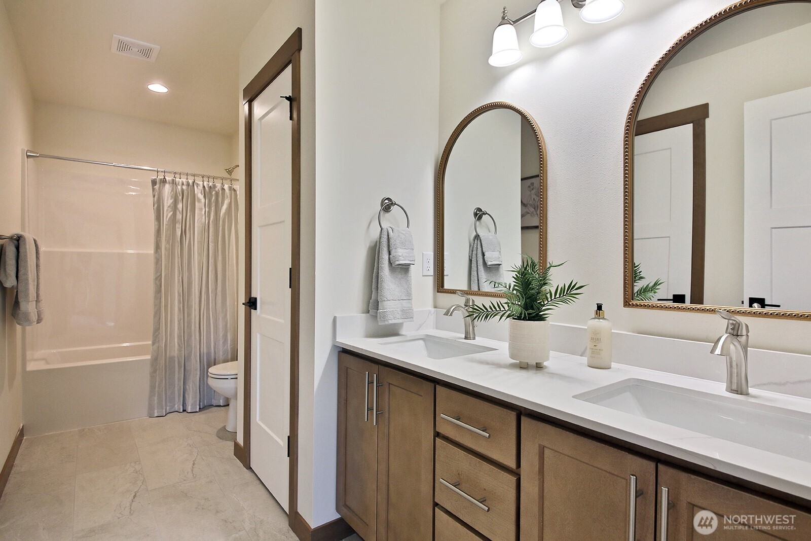 695 3rd Street, Unit B Langley, WA 98260 - Photo 23 of 28 a bathroom with a double vanity sink and a mirror