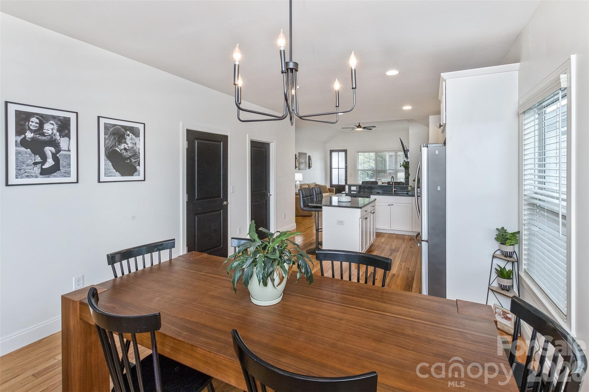 84 Rose Creek Road Leicester, NC 28748 - Photo 11 of 28 a view of a dining room with furniture and wooden floor