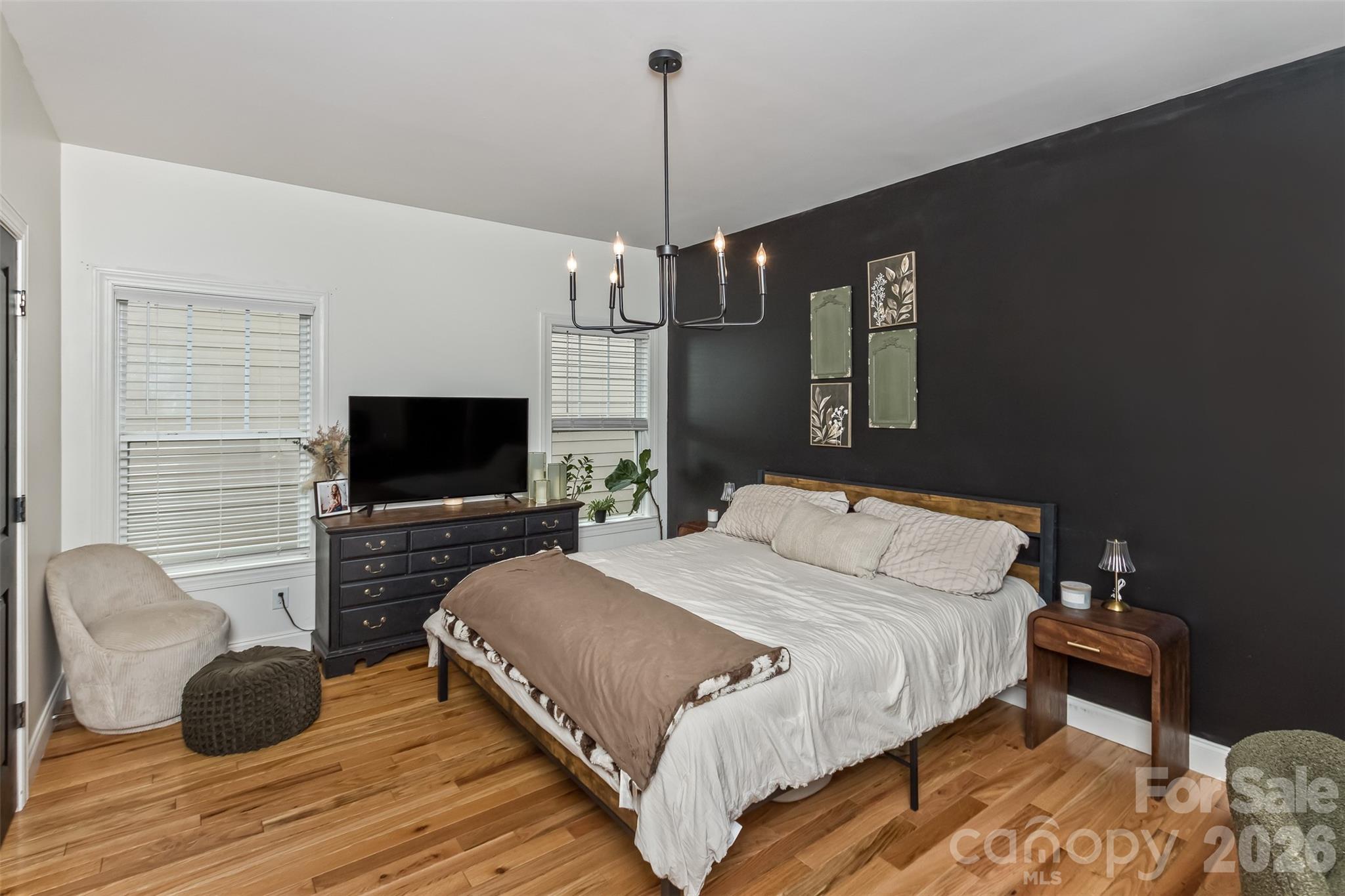 84 Rose Creek Road Leicester, NC 28748 - Photo 14 of 28 a bedroom with a bed and a flat screen tv