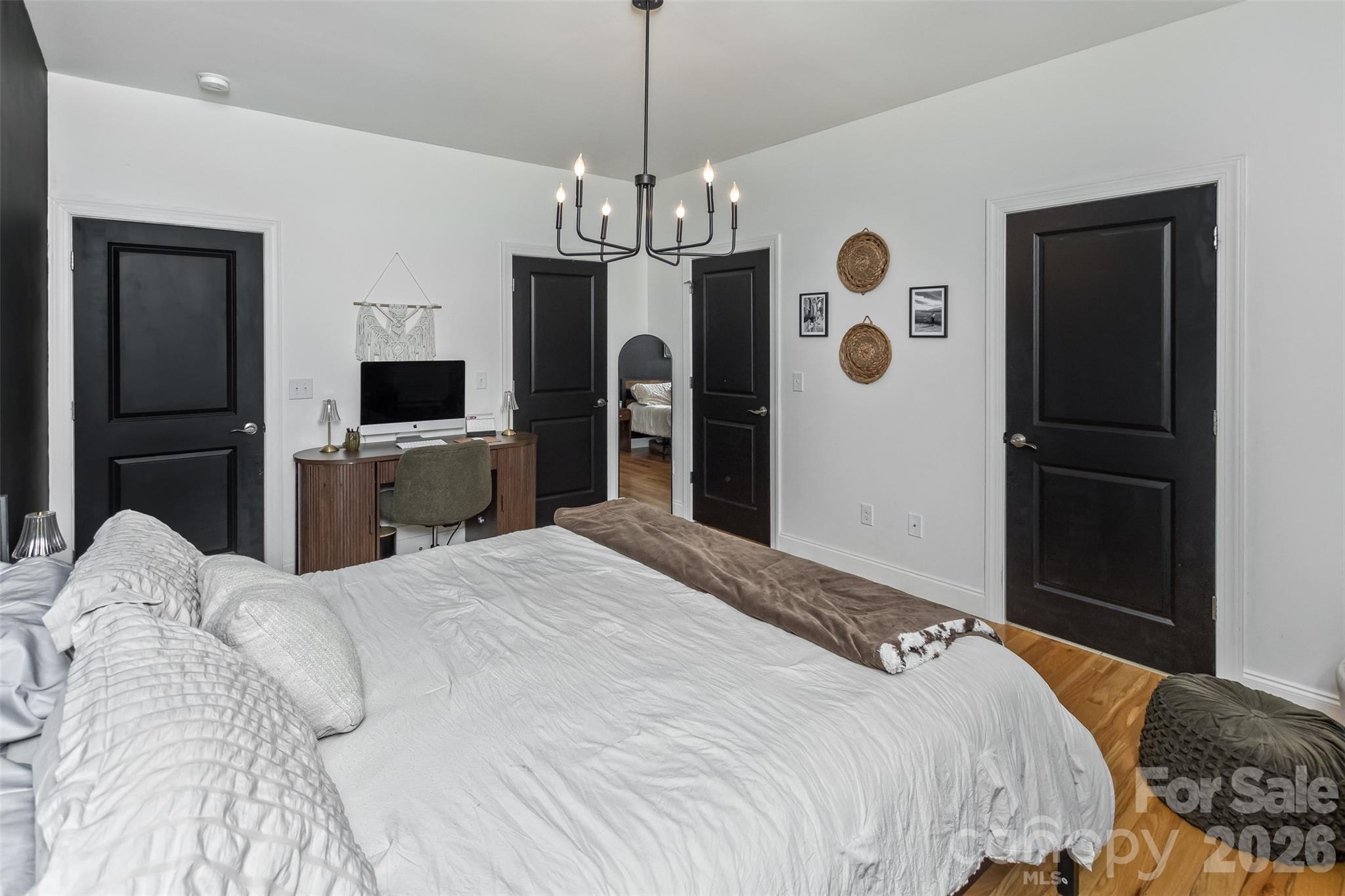 84 Rose Creek Road Leicester, NC 28748 - Photo 15 of 28 a bedroom with a bed and a flat tv screen