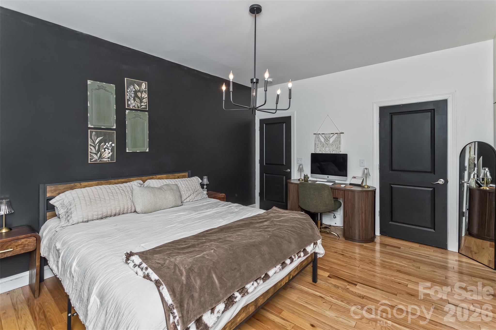 84 Rose Creek Road Leicester, NC 28748 - Photo 16 of 28 a bedroom with a bed and a flat screen tv