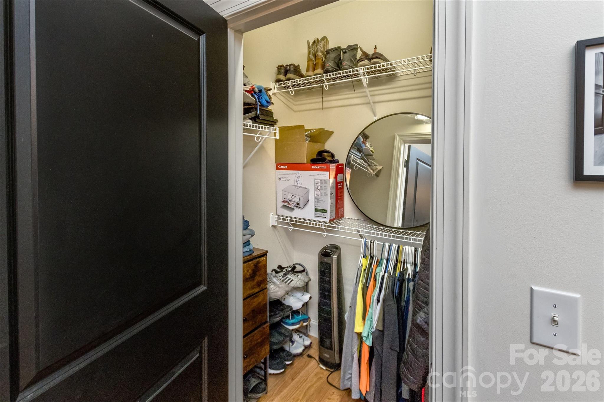 84 Rose Creek Road Leicester, NC 28748 - Photo 17 of 28 a view of walk in closet with clothes and shoes