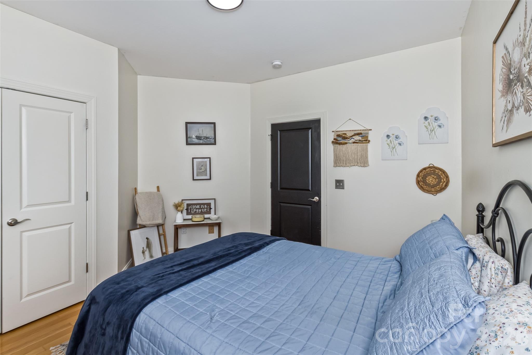 84 Rose Creek Road Leicester, NC 28748 - Photo 20 of 28 a bedroom with a bed and a cabinets