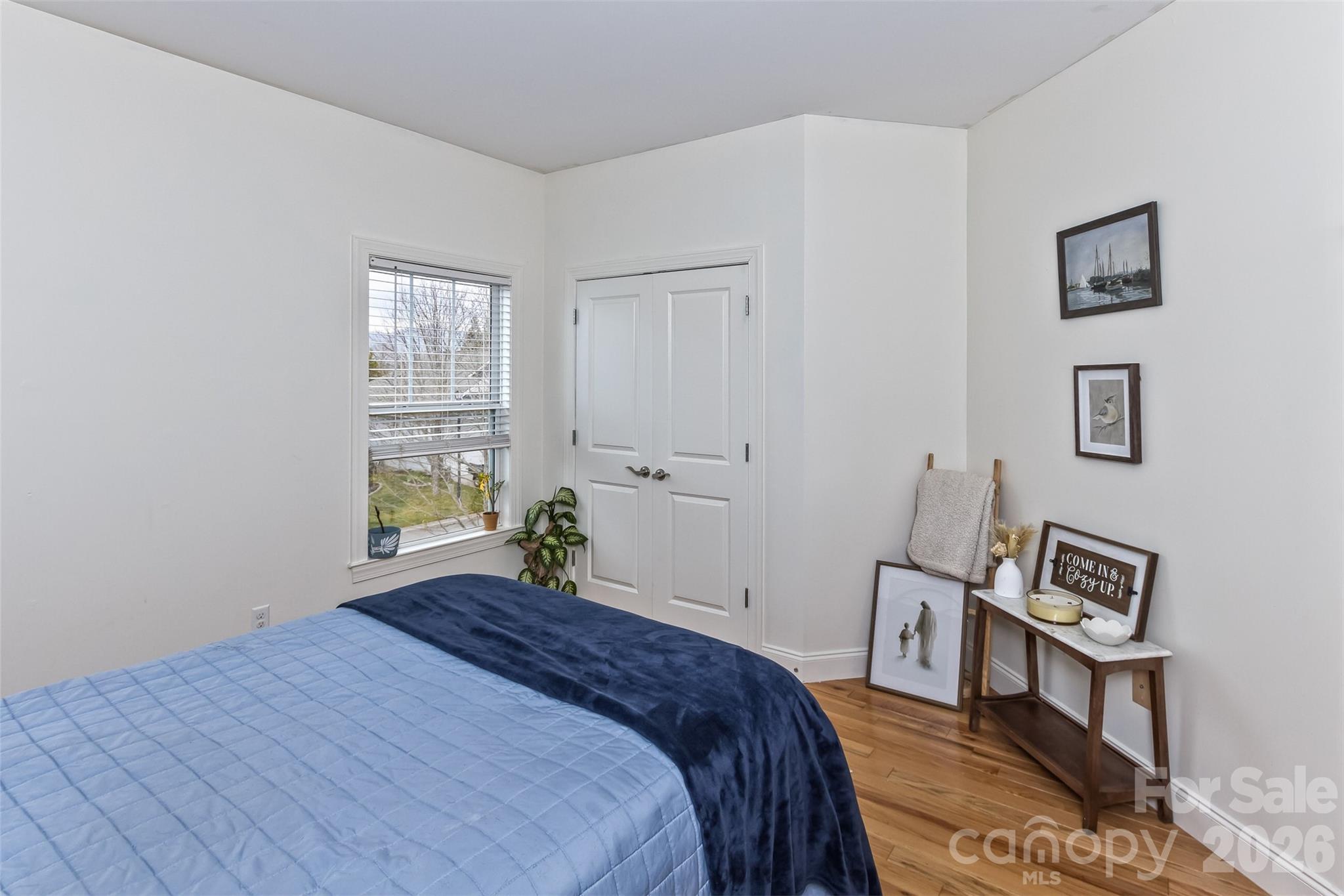 84 Rose Creek Road Leicester, NC 28748 - Photo 21 of 28 a bedroom with a bed and a window