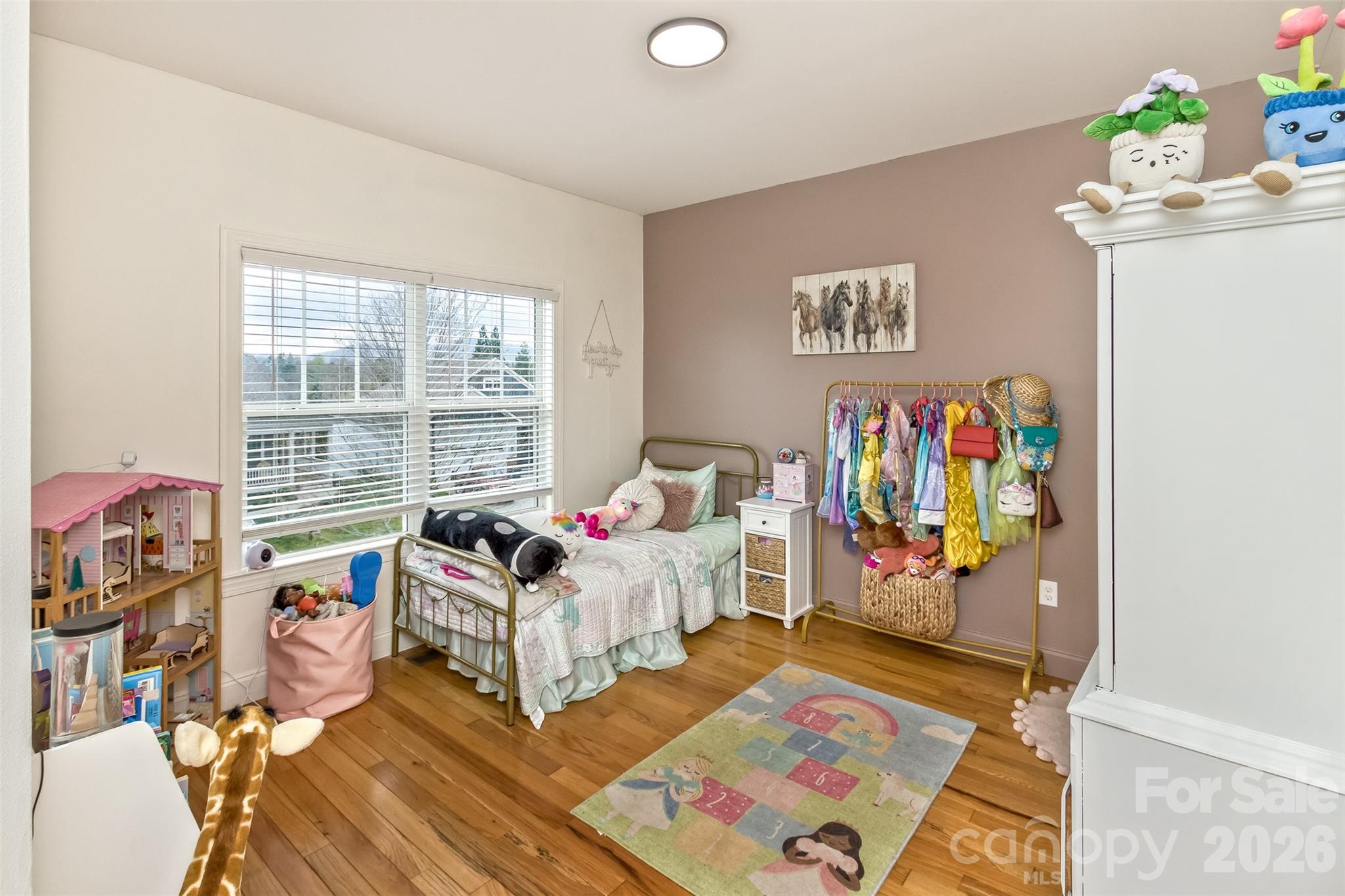 84 Rose Creek Road Leicester, NC 28748 - Photo 22 of 28 a bedroom with furniture and a bed