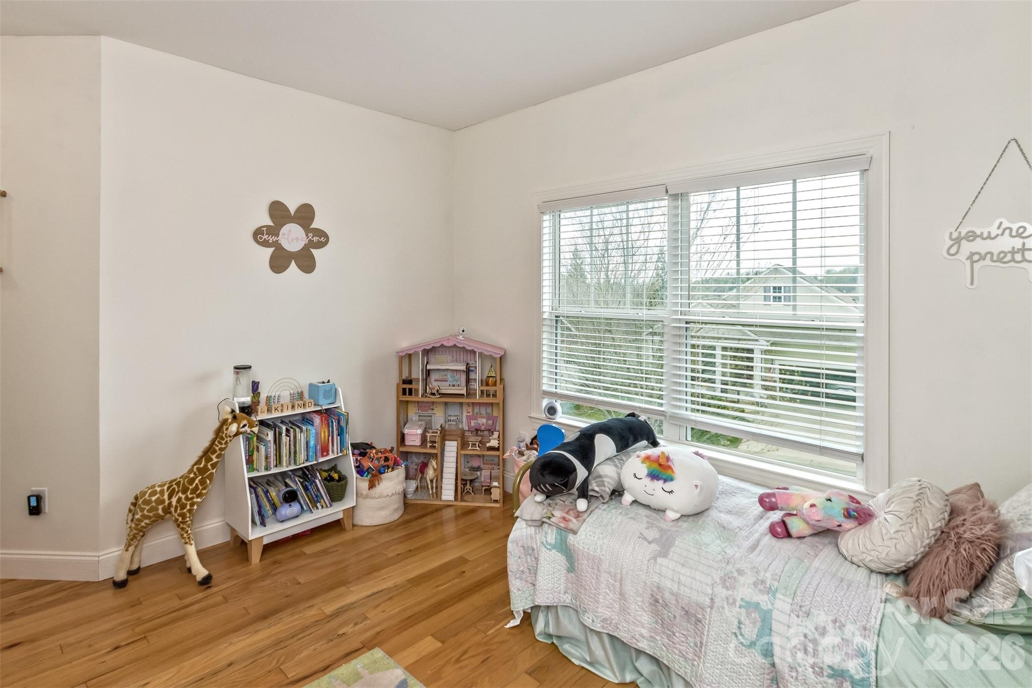 84 Rose Creek Road Leicester, NC 28748 - Photo 23 of 28 a bedroom with a bed and a window