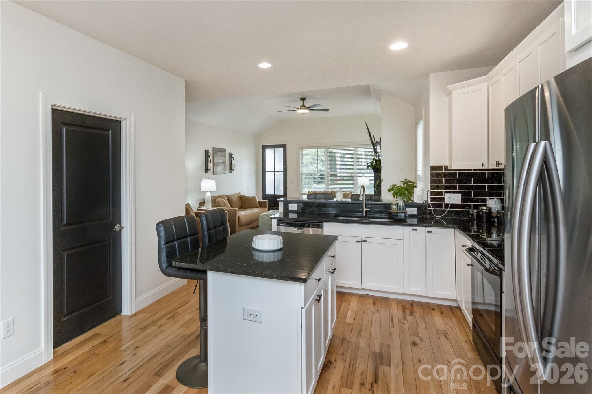 84 Rose Creek Road Leicester, NC 28748 - Photo 10 of 28 a kitchen with a refrigerator and a sink