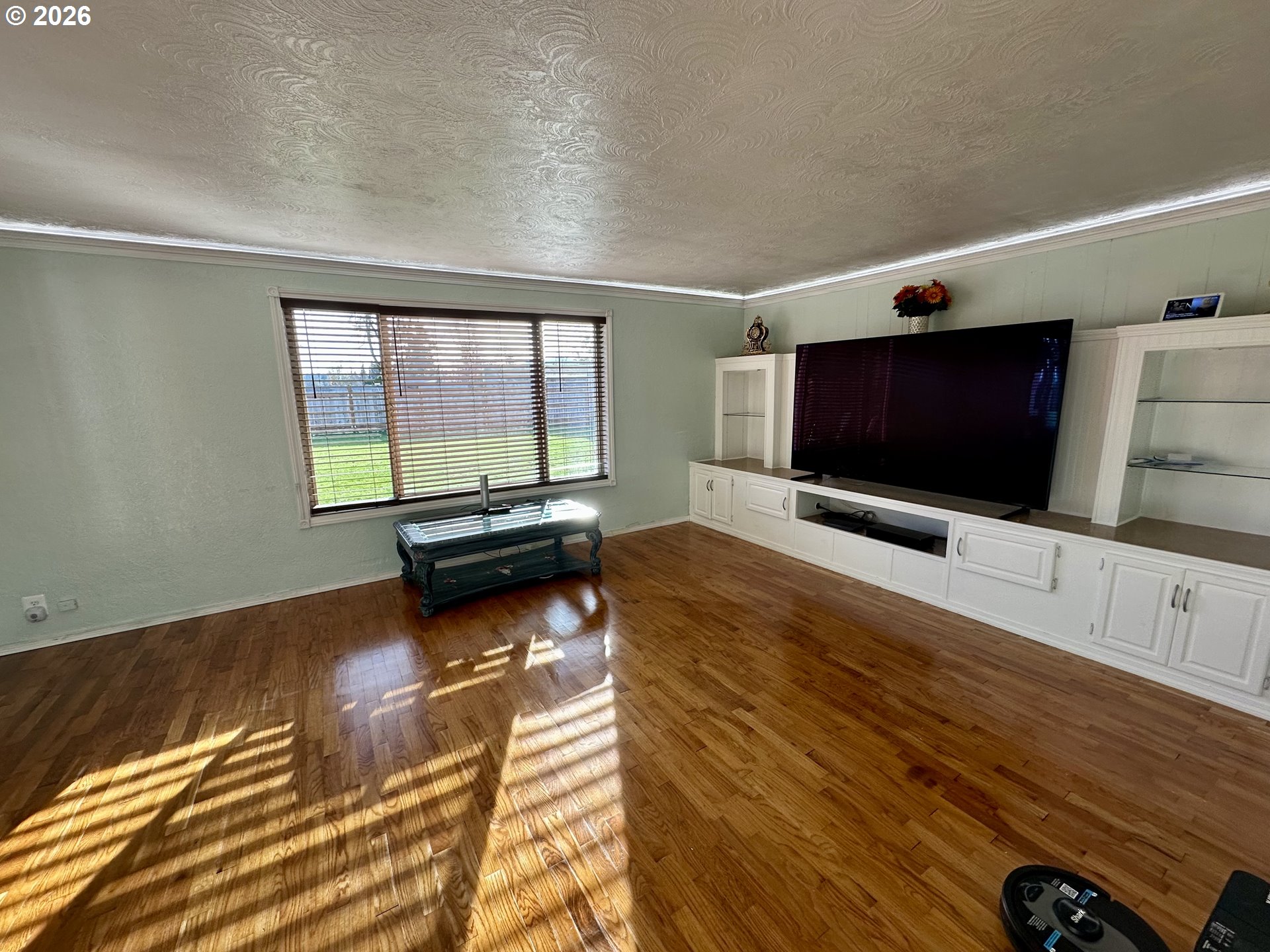 5664 Highbanks Road Springfield, OR 97478 - Photo 11 of 48 a living room with furniture and a flat screen tv