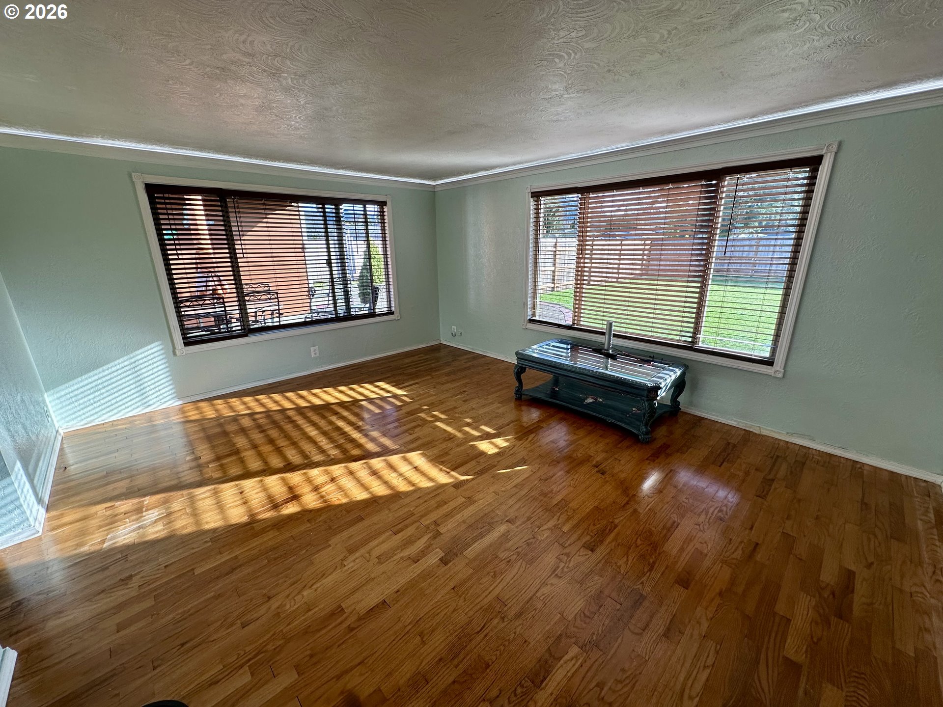 5664 Highbanks Road Springfield, OR 97478 - Photo 12 of 48 a view of an empty room with wooden floor and a window