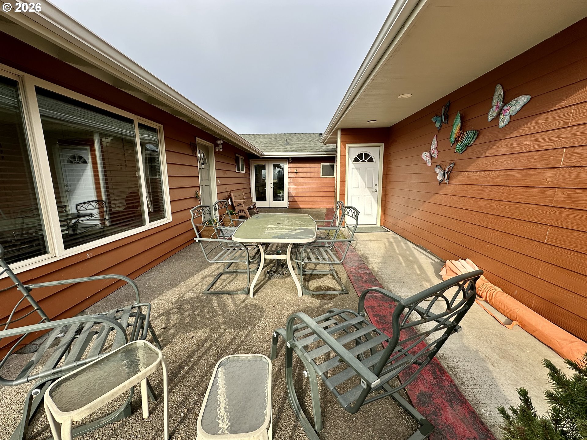 5664 Highbanks Road Springfield, OR 97478 - Photo 2 of 48 a balcony with table and chairs