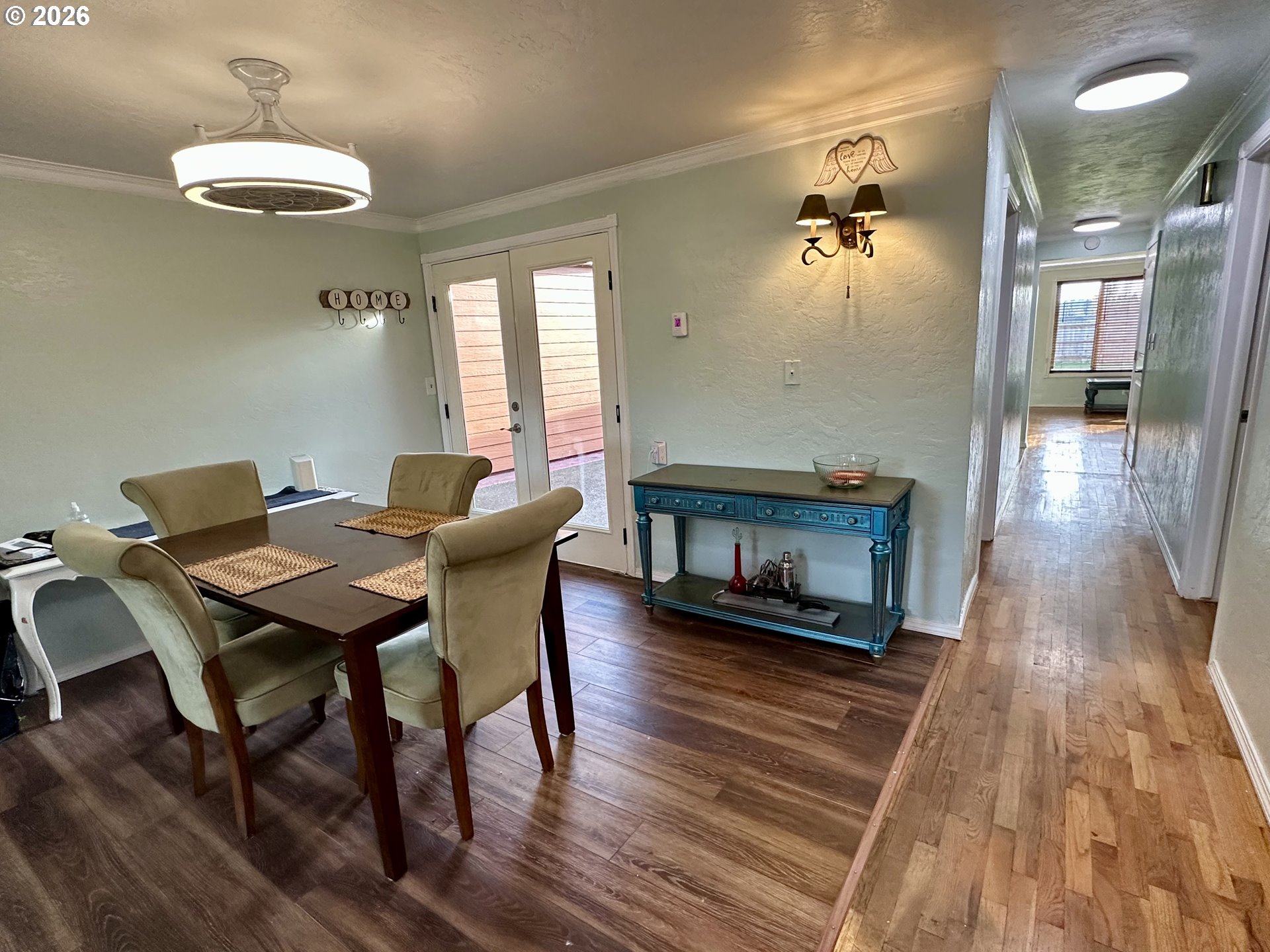 5664 Highbanks Road Springfield, OR 97478 - Photo 26 of 48 a view of a dining room with furniture wooden floor and a chandelier