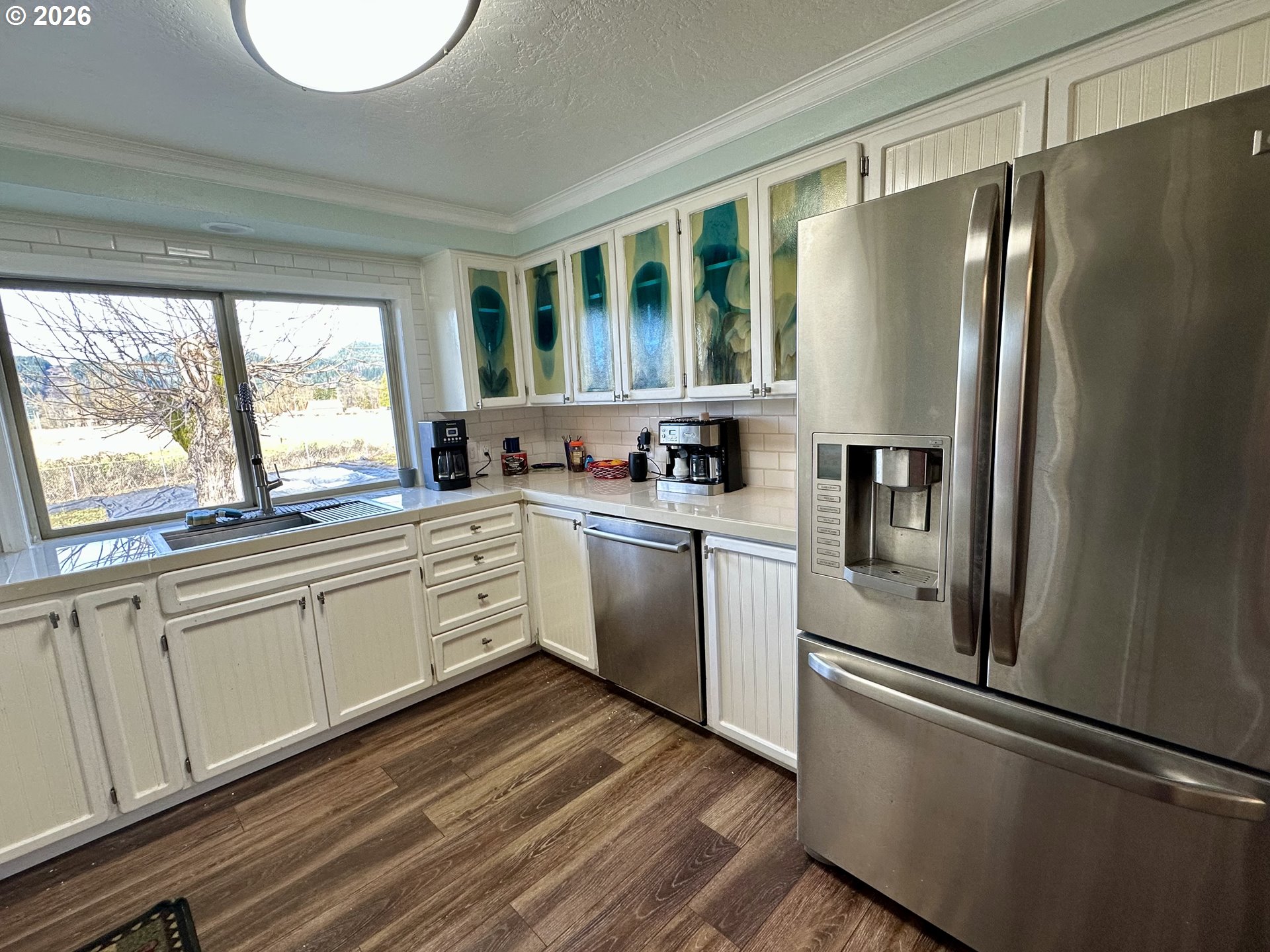 5664 Highbanks Road Springfield, OR 97478 - Photo 30 of 48 a kitchen with white cabinets and white appliances