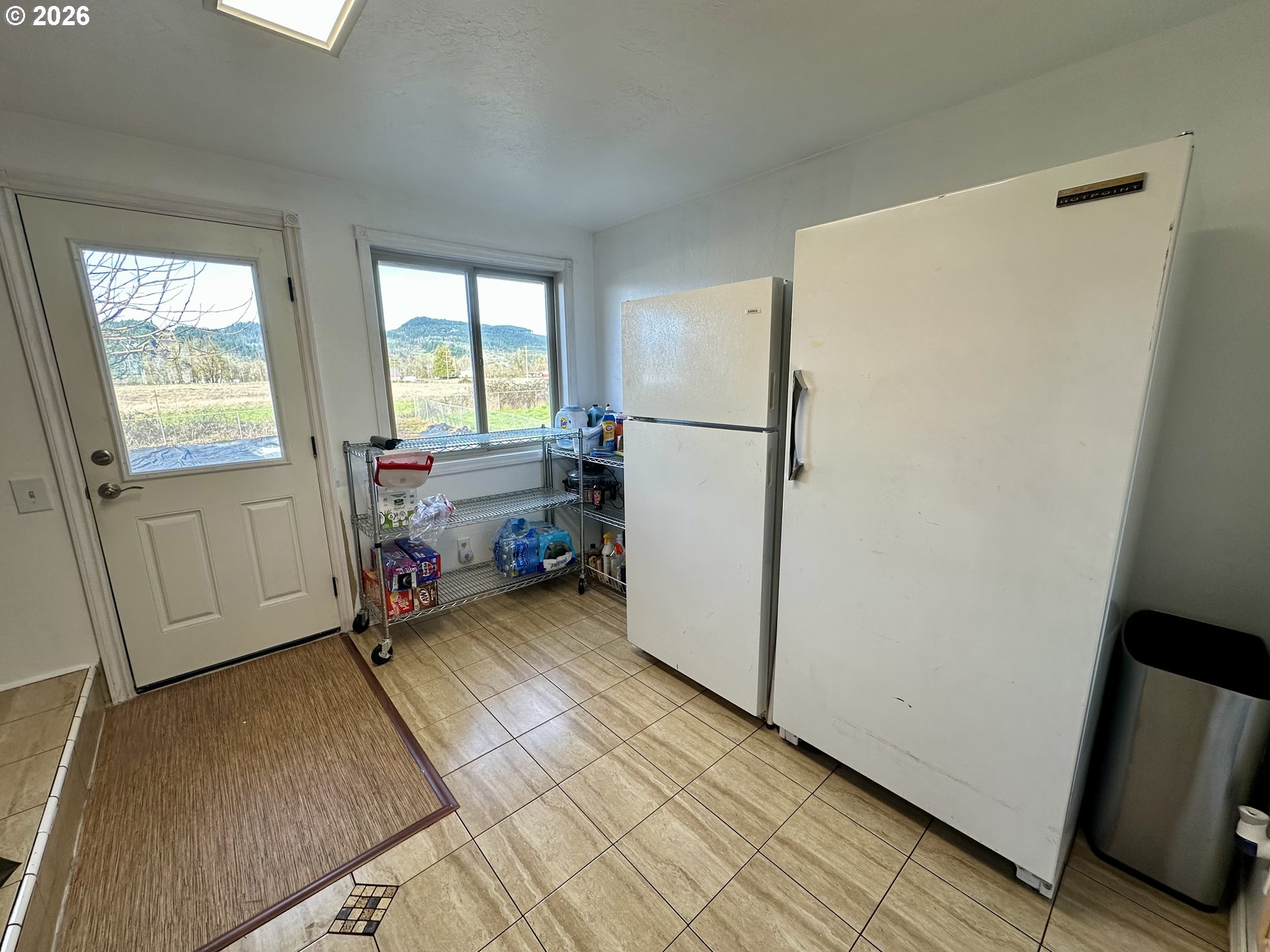 5664 Highbanks Road Springfield, OR 97478 - Photo 33 of 48 a view of a room with window and a refrigerator