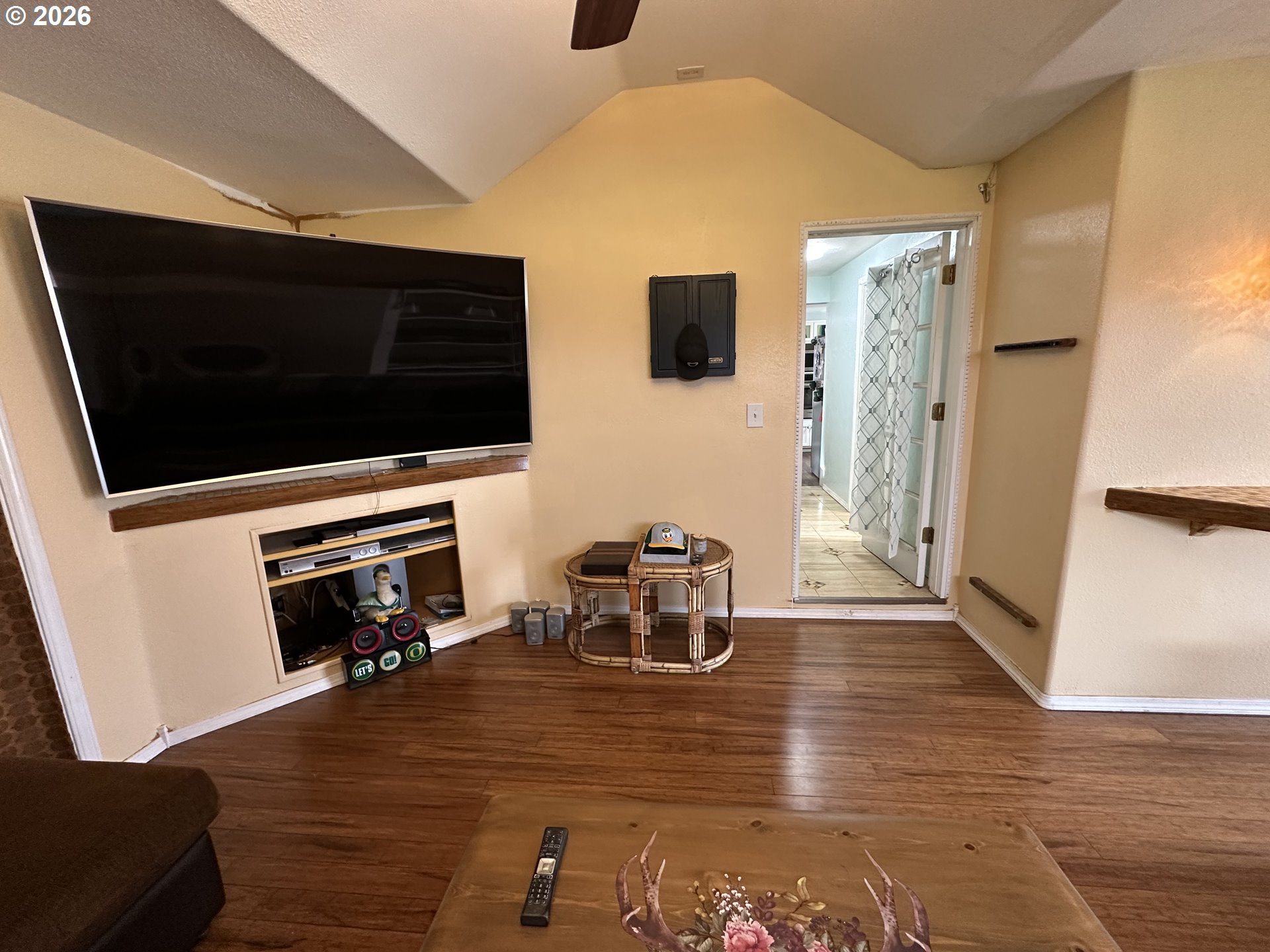 5664 Highbanks Road Springfield, OR 97478 - Photo 39 of 48 a living room with a flat screen tv and a fireplace