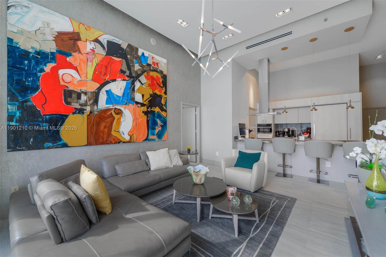 495 Brickell Avenue, Unit 2211 Miami, FL 33131 - Photo 4 of 27 a living room with furniture and a chandelier