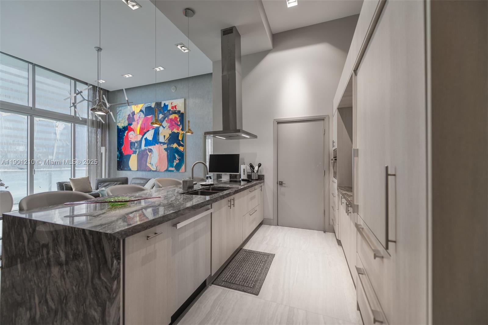 495 Brickell Avenue, Unit 2211 Miami, FL 33131 - Photo 8 of 27 a kitchen with stainless steel appliances granite countertop a sink and a stove