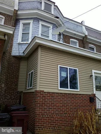 a view of a house with more windows and flower plants