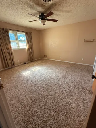 an empty room with a mirror