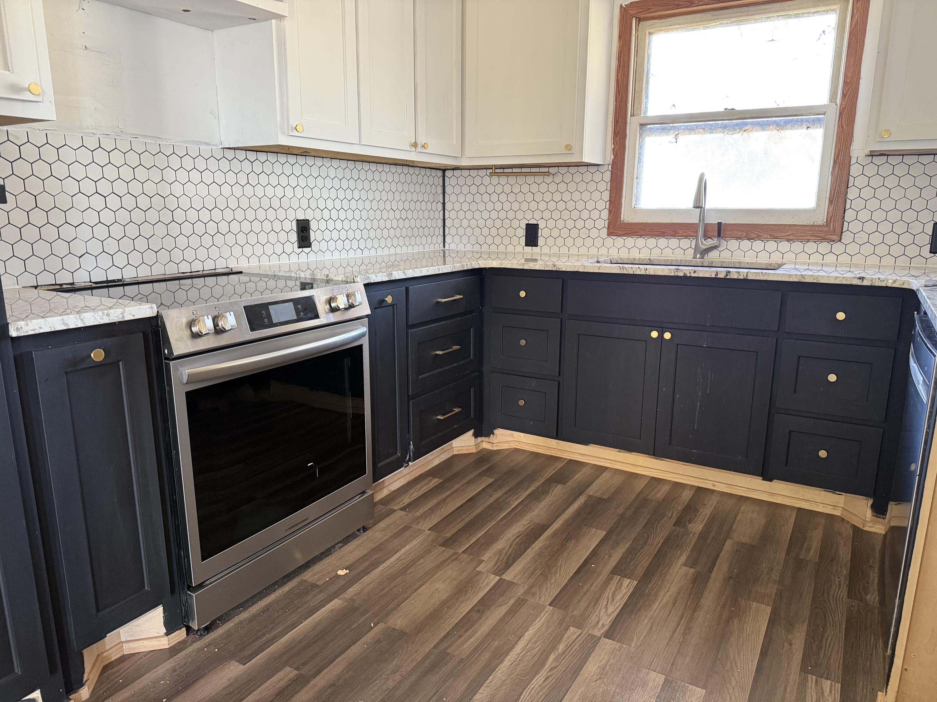 150 FM 2079 Muleshoe, TX 79347 - Photo 18 of 26 a kitchen with a sink stove and cabinets