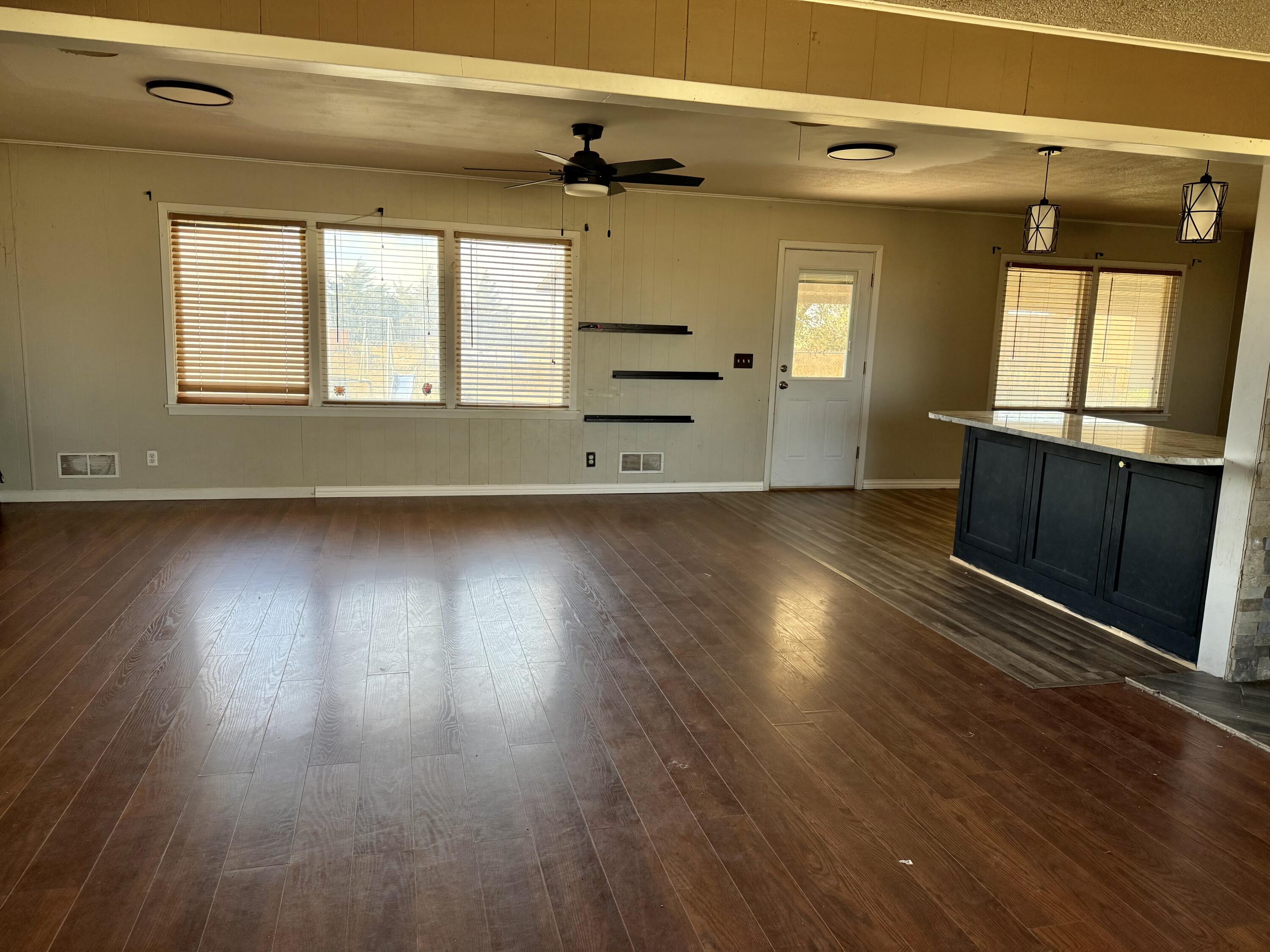 150 FM 2079 Muleshoe, TX 79347 - Photo 21 of 26 wooden floor in an empty room with a window