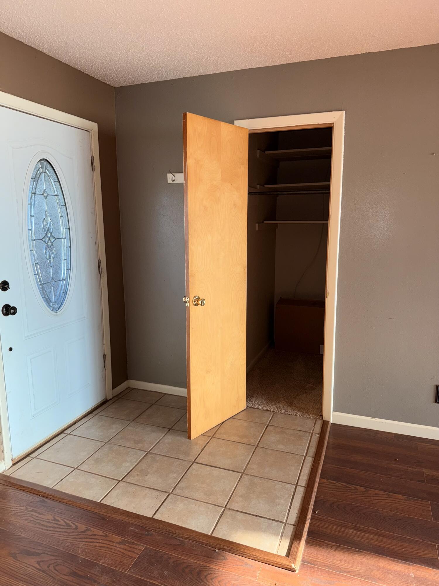 150 FM 2079 Muleshoe, TX 79347 - Photo 6 of 26 an empty room with wooden floor cabinet and mirror